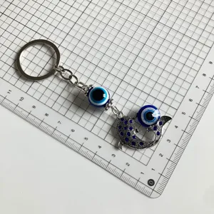 Turkish evil eye keychain with blue rhinestone fish pendant metal keyring size display