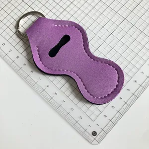 Étui porte-rouge à lèvres en néoprène violet avec anneau clé, housse baume à lèvres portable.