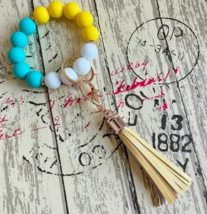 Bunte Silikonperlen Armband Schlüsselanhänger mit PU-Leder Quaste, trendiges Handgelenk Armband.