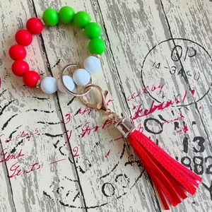 Buntes Silikonperlen Armband Schlüsselanhänger mit roter PU Leder Quaste und Gold.