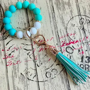 Bunte Silikon Perlen Armband Schlüsselanhänger mit PU Leder Quaste für Damen Alltag.