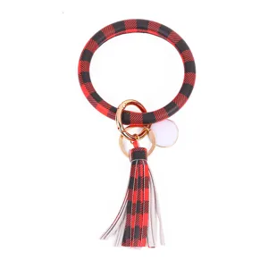 Rood zwart geruite PU lederen cirkel sleutelhanger met kwastje en lege sublimatie schijf.