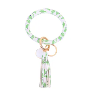 Cactus print PU leer rond armband sleutelhanger met kwastje, stijlvolle pols accessoire sleutels.