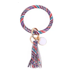 PU lederen armband sleutelhanger met kwast en geometrische print, stijlvolle polssleutelhanger.