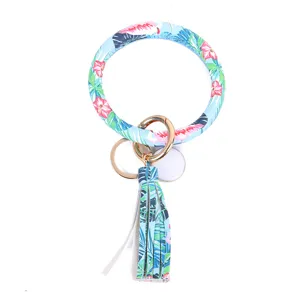 Tropische print PU lederen ronde armband sleutelhanger met kwastje en metalen ring.