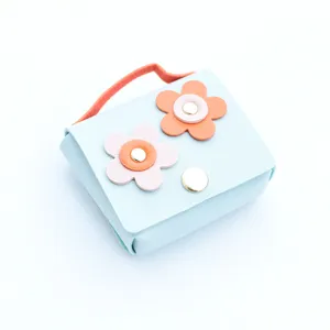 Cute leather flower mini pouch, multi-functional coin purse and earphone case bag charm accessory.