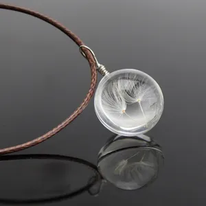 Glass globe dandelion seeds pendant necklace with brown braided cord detail shot close-up