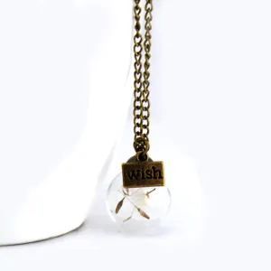 Bronze chain necklace with glass globe pendant, dried dandelion seeds and letter charm.