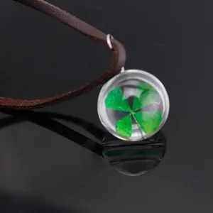 Four-leaf clover glass pendant necklace with brown leather cord, clear plant specimen jewelry gift