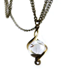 Vintage bronze chain necklace featuring a clear glass ball pendant with natural dandelion seed.