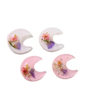 Epoxy dried flower resin crescent moon accessories for DIY hair clips and phone cases.