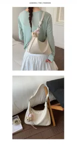 Chic minimalist hobo shoulder bag with cute bear charm for women daily commuting fashion.