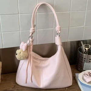 Pink PU leather hobo shoulder bag with cute plush pendant for women commuter daily casual use.