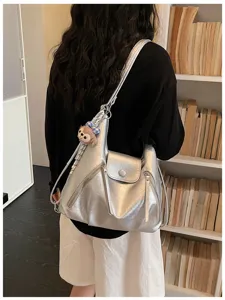 Korean style metallic silver hobo shoulder tote bag with zipper pockets and cute plush toy.