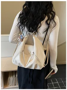 Stylish Korean style multi-way women backpack handbag in soft beige design with zippers.