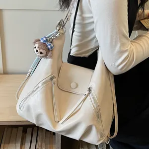 Chic PU leather women shoulder bag with cute plush pendant, multi-functional stylish handbag.