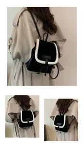 Detailed view of the black plush backpack with white shearling trim worn on model, stylish.