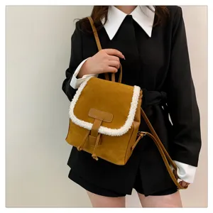 Womens vintage brown shearling mini backpack detailed view for everyday outfit style.