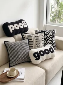 Modern black and white letter throw pillow set for living room sofa and home decor.