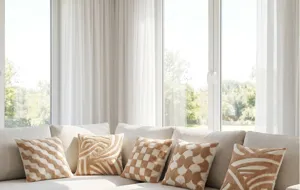 Cream tufted abstract pattern throw pillow cushion, ideal for modern living room decor.