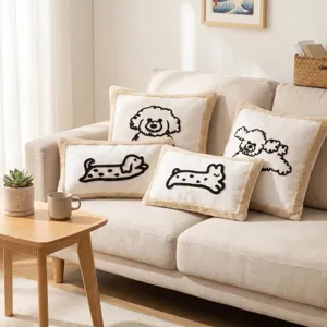 Close-up detail of cozy Nordic style dog embroidered throw pillow cover with cute tassels.