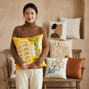Cozy yellow embroidered throw pillow with floral pattern, perfect for modern living room sofa decor.
