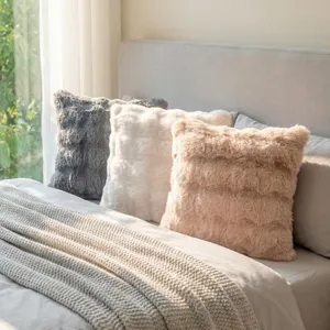 Plush faux rabbit fur throw pillow with chic carved pattern, soft decorative cushion detail.