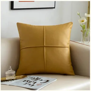 Mustard yellow PU leather throw pillow, modern minimalist decorative cushion with cross stitch.