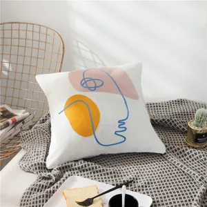 Nordic abstract face throw pillow detail, artistic embroidered cushion cover for modern sofa decor.