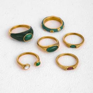 Detailed shot of a 6-piece vintage stainless steel ring set with malachite pattern and green enamel.