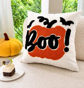 Halloween pumpkin pillow detail with exquisite tufting embroidery and festive design.