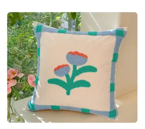 Detailed close-up view of cute retro tufted tulip flower throw pillow with checkered border.