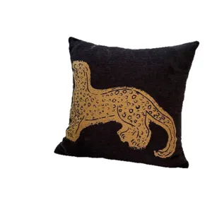 Vintage style decorative throw pillow with artistic gold leopard print on black fabric for sofa.