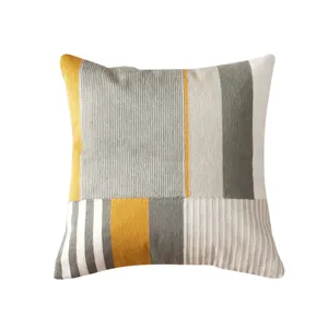 Nordic minimalist knitted throw pillow with geometric vertical stripes yellow grey white