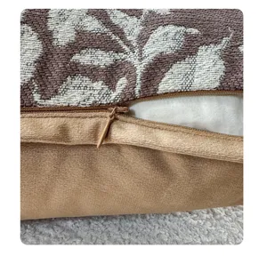 Close-up detail of vintage style French pillow cover, textured bamboo print fabric zipper.