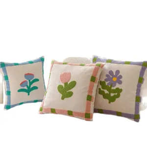 Retro tufted floral throw pillow with cute tulip and daisy embroidery. Soft cream cushion for sofa.