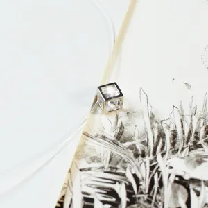 Close-up view of a minimalist invisible thread necklace featuring a sparkling cubic zirconia pendant.