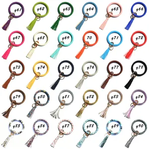 Gedetailleerd overzicht van PU lederen polsband sleutelhangers met kwastjes in diverse kleuren.