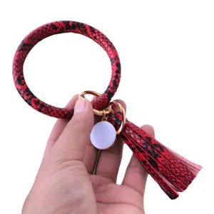 Portachiavi ad anello in pelle di serpente rosso nero con elegante nappa da donna
