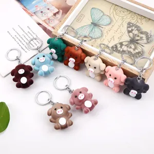 Cute plush pig keychain with soft flocking texture, lovely animal keyring for bag charm.