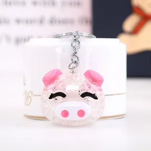 Cute acrylic pig keychain detail shot, clear cracked texture design, perfect bag charm pendant.