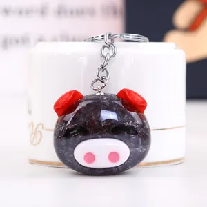 Cute crystal pig acrylic keychain detailed close-up shot, ideal cartoon accessory.
