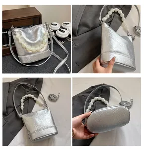 Silver metallic bucket bag with large white pearl beaded handle stylish shoulder bag