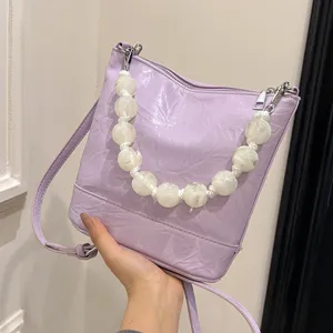 Chic lavender bucket bag with beaded handle, trendy PU leather shoulder and crossbody purse.