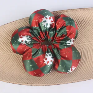 Christmas plaid hair scrunchie with cute white snowflake print, soft satin fabric hair tie accessory.