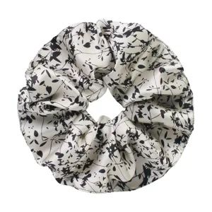 Elegant black and white floral print silk scrunchie, soft hair tie for daily styling.