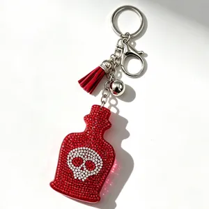 Roter Strass Totenkopf Parfümfläschchen Schlüsselanhänger mit Quaste und Anhänger.