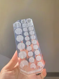Transparent 26-hole makeup brush holder acrylic cosmetic organizer for eyebrow pencils and pens.
