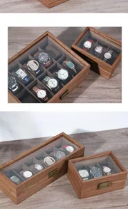 Walnut wood watch storage box with glass lid and multiple slots for collection display