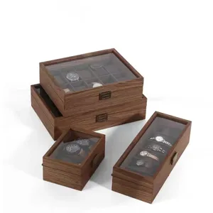 Walnut wood watch box with glass lid, vintage storage case for wristwatches and jewelry display.